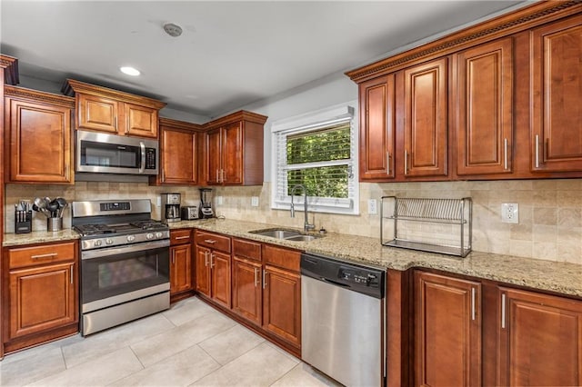3307 Pointe Bleue Ct, Decatur, GA 30034 - kitchen featuring appliances with stainless steel finishes, a sink, light stone counters, and recessed lighting