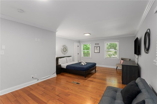 3307 Pointe Bleue Ct, Decatur, GA 30034 - bedroom with light wood-style floors, crown molding, and baseboards