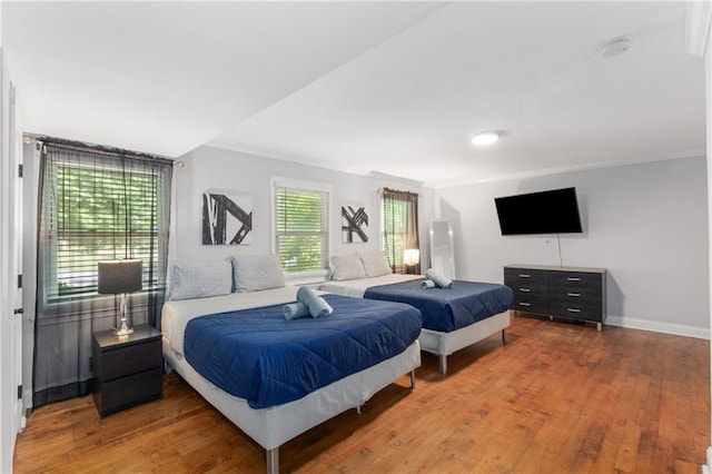 3307 Pointe Bleue Ct, Decatur, GA 30034 - bedroom featuring crown molding, wood finished floors, and baseboards