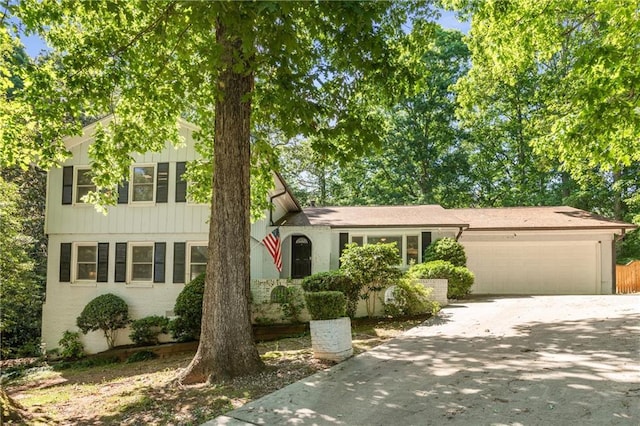 3307 Pointe Bleue Ct, Decatur, GA 30034 - view of front of house with a garage, driveway, and board and batten siding