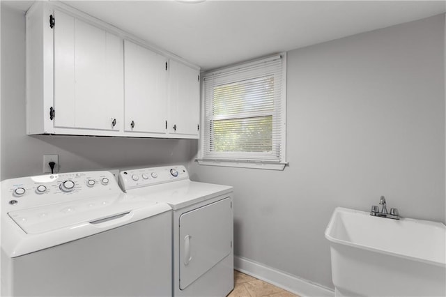 3307 Pointe Bleue Ct, Decatur, GA 30034 - clothes washing area featuring washer and clothes dryer, cabinet space, and baseboards