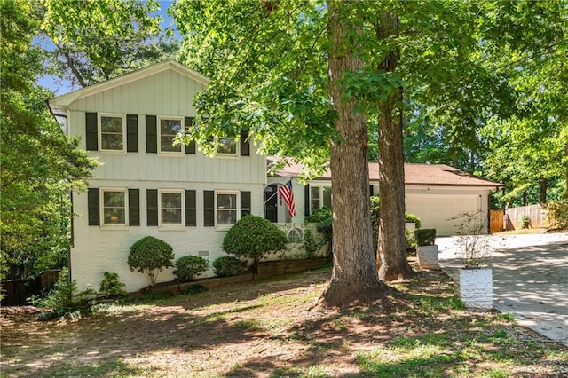3307 Pointe Bleue Ct, Decatur, GA 30034 - view of front of house with driveway, a garage, fence, and board and batten siding