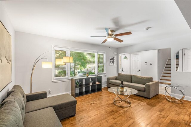 3307 Pointe Bleue Ct, Decatur, GA 30034 - living room with wood finished floors, stairs, ceiling fan, and baseboards