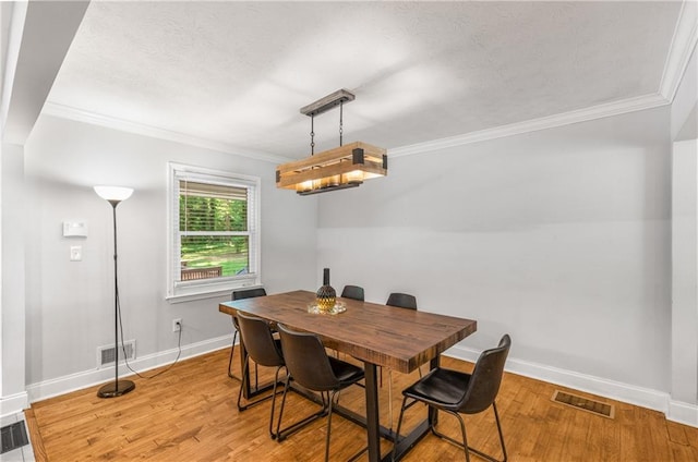 3307 Pointe Bleue Ct, Decatur, GA 30034 - dining area with baseboards, crown molding, light wood finished floors, and a textured ceiling