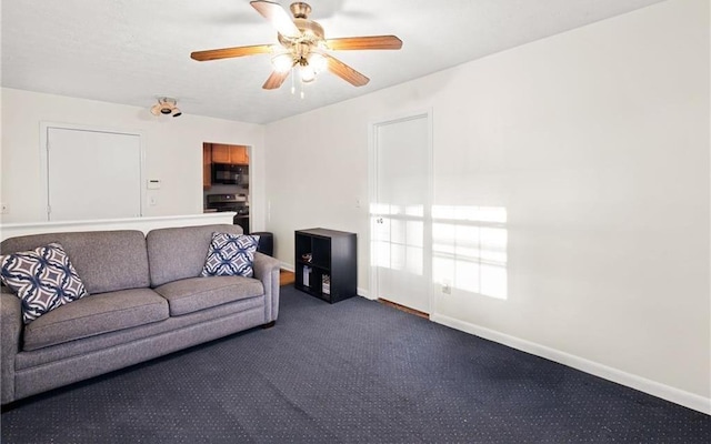 1729 Norden Rd, Riverdale, GA 30296 - living room with baseboards, dark colored carpet, and a ceiling fan