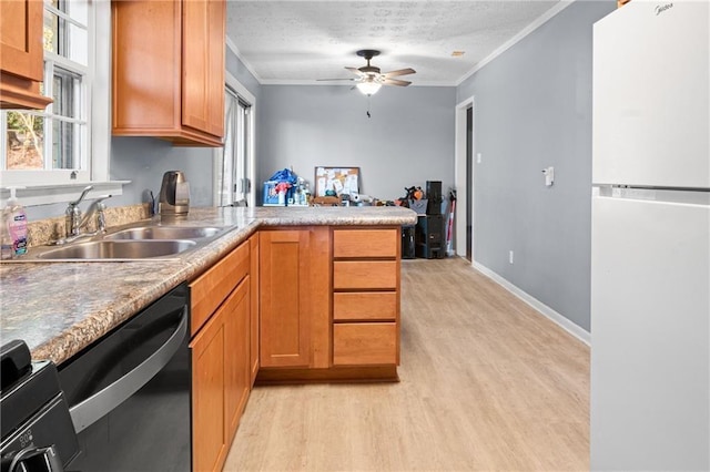 1729 Norden Rd, Riverdale, GA 30296 - kitchen featuring crown molding, a sink, freestanding refrigerator, dishwasher, and a textured ceiling