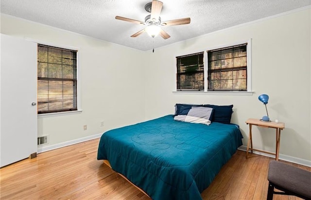 1729 Norden Rd, Riverdale, GA 30296 - bedroom with baseboards, a textured ceiling, visible vents, and wood finished floors