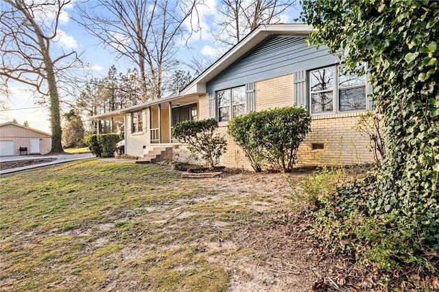 1729 Norden Rd, Riverdale, GA 30296 - view of side of property featuring a lawn, brick siding, a garage, and crawl space