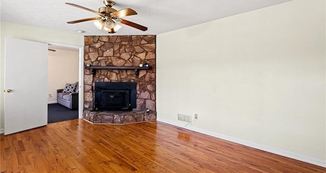 1729 Norden Rd, Riverdale, GA 30296 - unfurnished living room with baseboards, visible vents, wood finished floors, and a ceiling fan