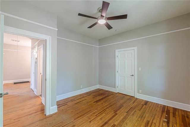 1967 W John Calvin Ave, Atlanta, GA 30337 - unfurnished room with wood finished floors, a ceiling fan, and baseboards