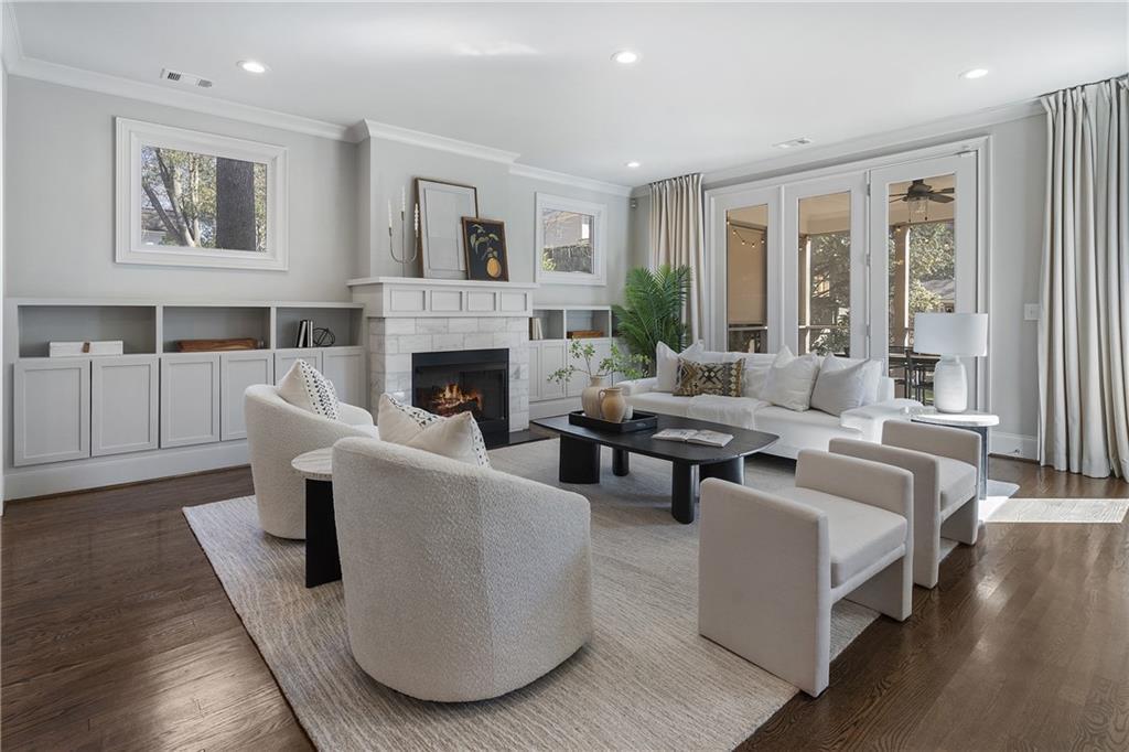 living room featuring crown molding and dark hardwood / wood-style floors