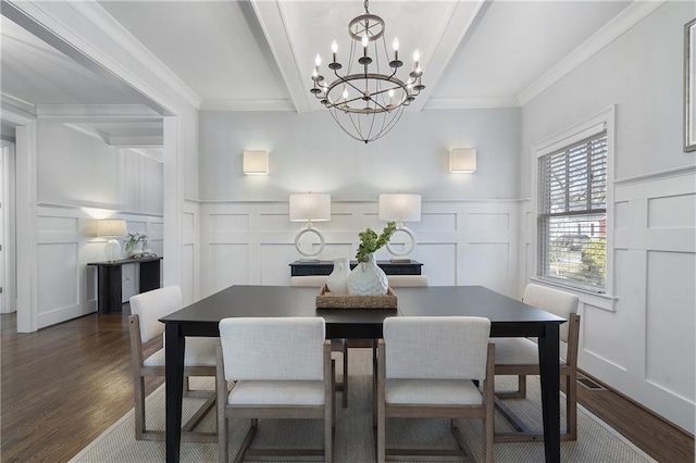 dining area with an inviting chandelier, ornamental molding, dark hardwood / wood-style floors, and beamed ceiling