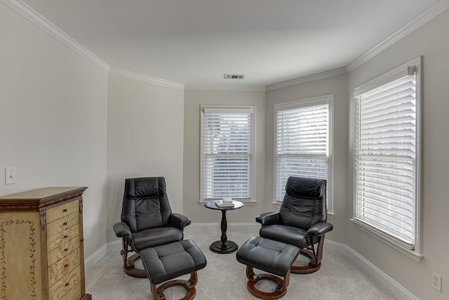 living area with ornamental molding, plenty of natural light, and carpet floors