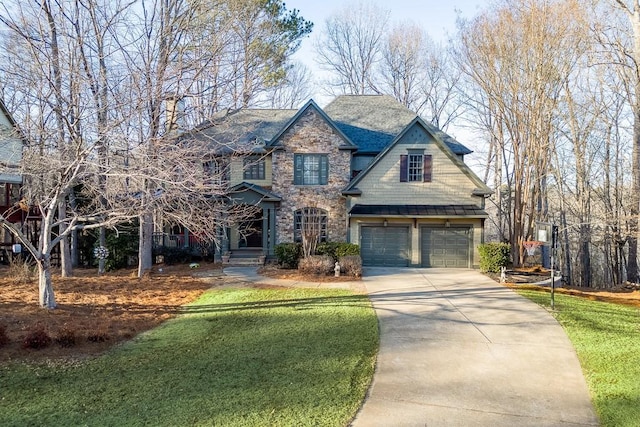 view of front facade with a garage and a front lawn