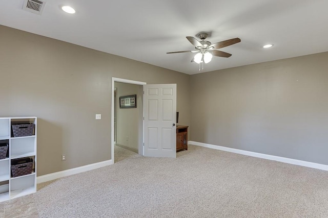 carpeted empty room with ceiling fan