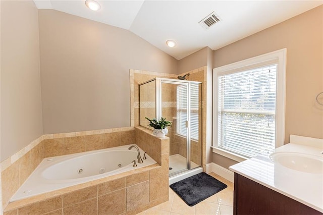 bathroom with tile patterned flooring, plenty of natural light, separate shower and tub, and lofted ceiling