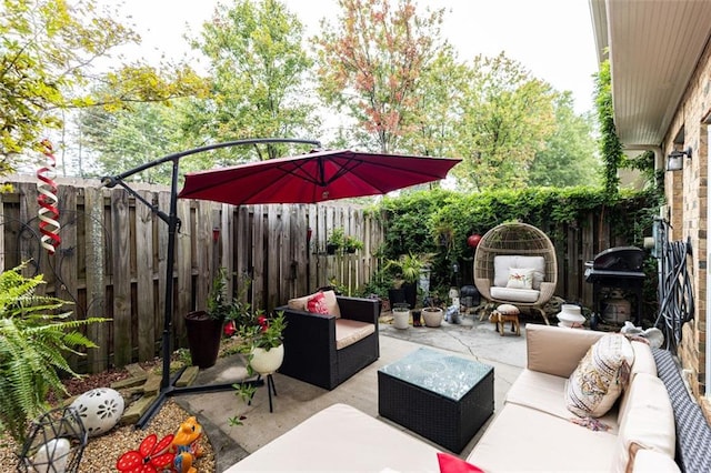 view of patio / terrace featuring an outdoor hangout area and a grill