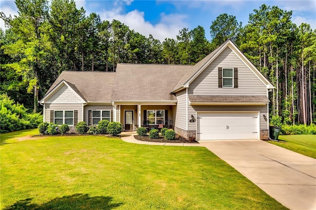 1412 Chapman Cir, Monroe, GA 30656 - view of front facade with a garage, a front yard, concrete driveway, covered porch, and roof with shingles