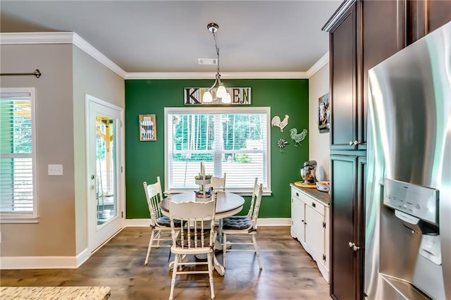 1412 Chapman Cir, Monroe, GA 30656 - dining room featuring crown molding, a chandelier, and dark wood-style floors