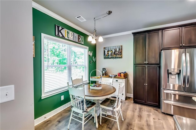 1412 Chapman Cir, Monroe, GA 30656 - dining room with ornamental molding and light wood-style floors