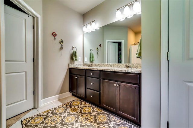 1412 Chapman Cir, Monroe, GA 30656 - bathroom with double vanity and tile patterned floors