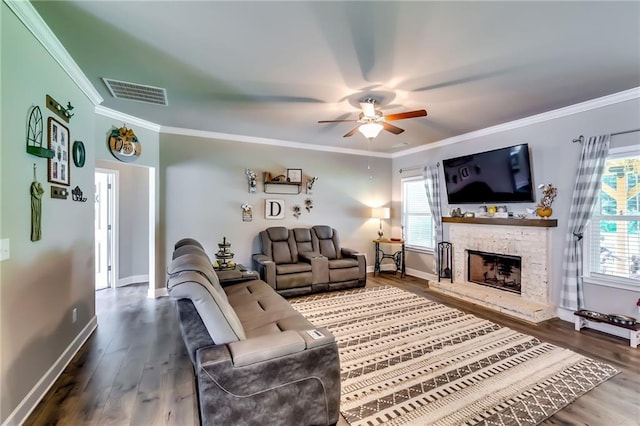 1412 Chapman Cir, Monroe, GA 30656 - living room featuring ornamental molding, ceiling fan, wood finished floors, and a fireplace