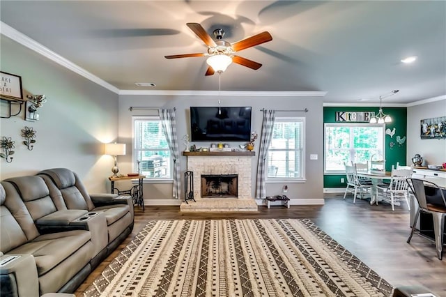 1412 Chapman Cir, Monroe, GA 30656 - living room featuring a ceiling fan, wood finished floors, crown molding, and a fireplace