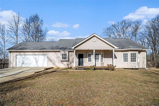 single story home with covered porch, concrete driveway, a front lawn, and a garage