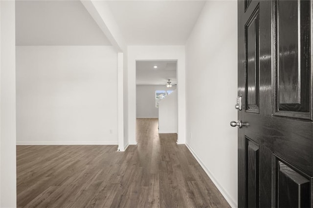 hall with dark wood-type flooring