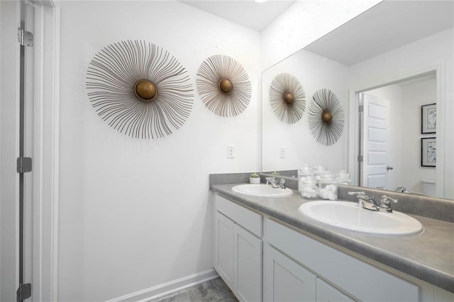 bathroom with tile patterned floors, toilet, and vanity