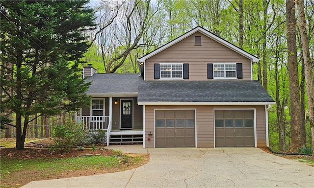 5415 Keithwood Dr, Cumming, GA 30040 - tri-level home with a garage, a porch, concrete driveway, and a shingled roof