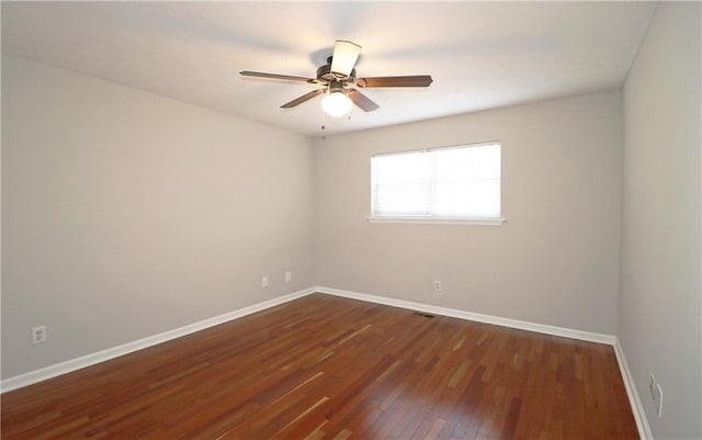 5415 Keithwood Dr, Cumming, GA 30040 - empty room featuring dark wood-style flooring, baseboards, and a ceiling fan