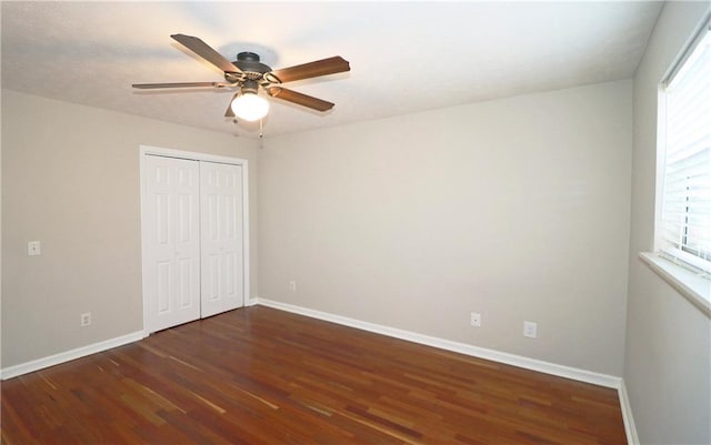 5415 Keithwood Dr, Cumming, GA 30040 - unfurnished bedroom with wood finished floors, ceiling fan, baseboards, and a closet