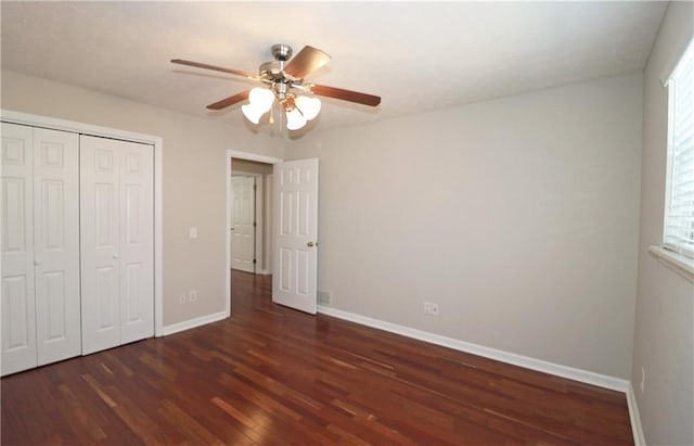 5415 Keithwood Dr, Cumming, GA 30040 - unfurnished bedroom with a closet, baseboards, a ceiling fan, and wood finished floors