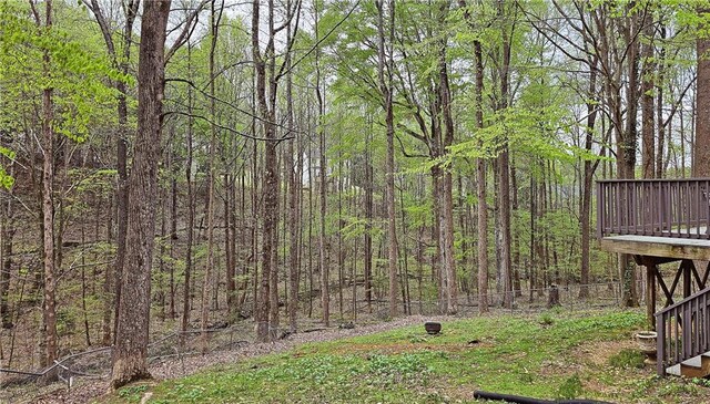 5415 Keithwood Dr, Cumming, GA 30040 - view of yard featuring a view of trees and a wooden deck
