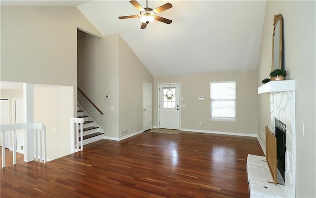 5415 Keithwood Dr, Cumming, GA 30040 - unfurnished living room featuring high vaulted ceiling, a fireplace with raised hearth, wood finished floors, and ceiling fan