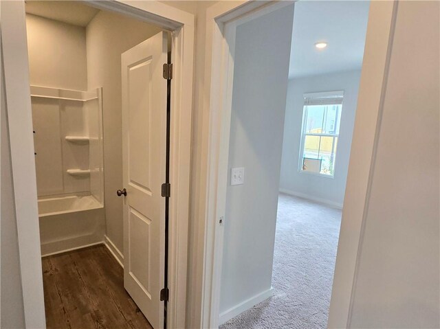 unfurnished living room featuring baseboards, a fireplace, visible vents, and wood finished floors