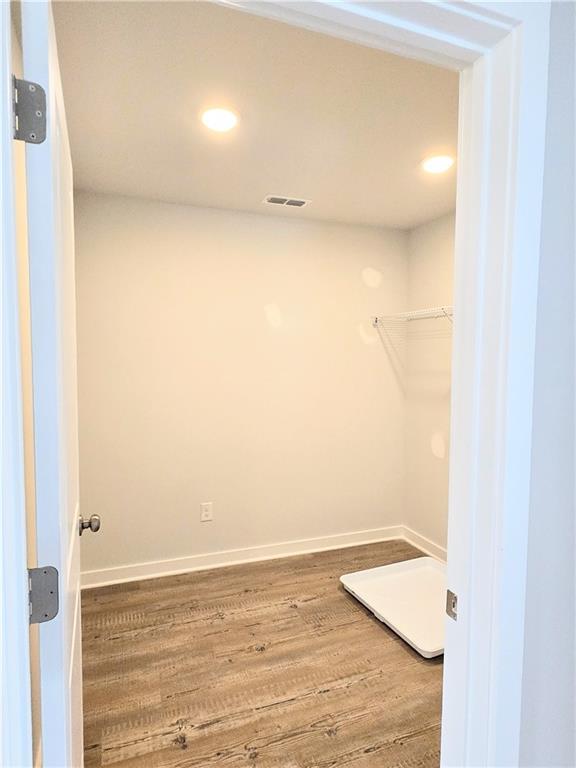 unfurnished room with carpet floors and baseboards