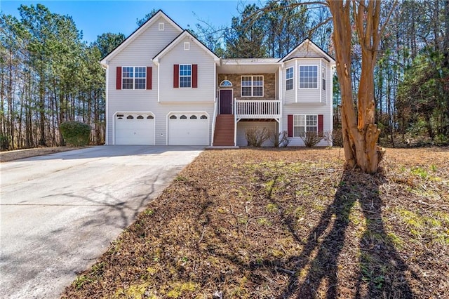 split foyer home featuring a garage and driveway