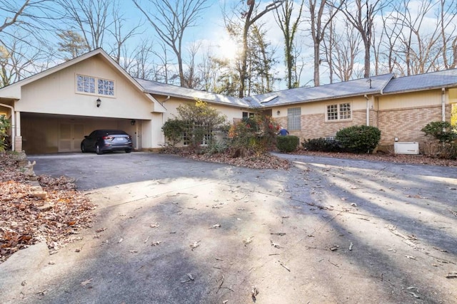 single story home with a garage