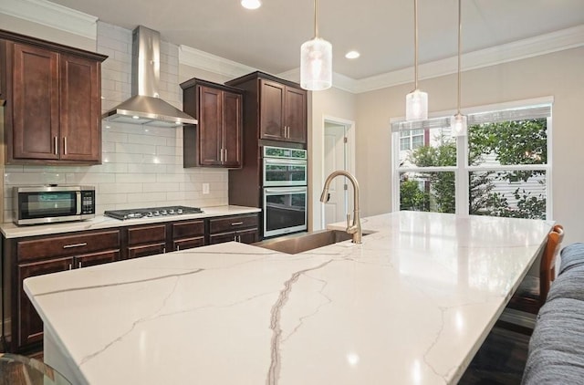 1630 Eaglerock Dr, Suwanee, GA 30024 - kitchen with wall chimney exhaust hood, appliances with stainless steel finishes, backsplash, ornamental molding, and hanging light fixtures