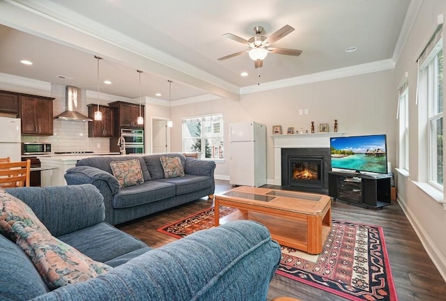 1630 Eaglerock Dr, Suwanee, GA 30024 - living room featuring healthy amount of natural light, dark wood-style floors, ceiling fan, a glass covered fireplace, and recessed lighting