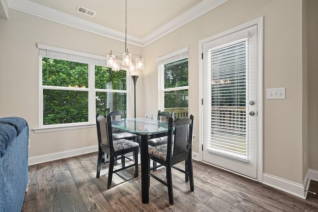 1630 Eaglerock Dr, Suwanee, GA 30024 - dining area featuring ornamental molding, a chandelier, and dark wood finished floors