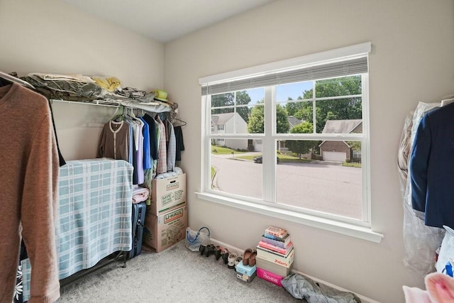 1630 Eaglerock Dr, Suwanee, GA 30024 - walk in closet featuring carpet