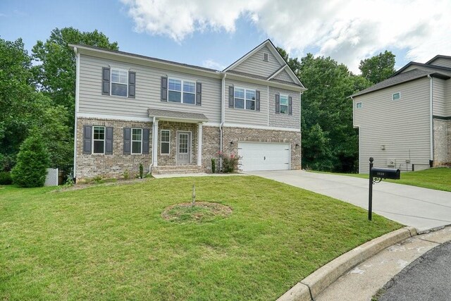 1630 Eaglerock Dr, Suwanee, GA 30024 - craftsman-style home featuring brick siding, driveway, a garage, and a front yard