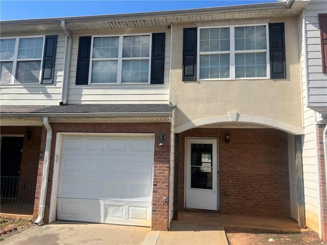730 Georgetown Ln, Jonesboro, GA 30236 - doorway to property with brick siding and an attached garage