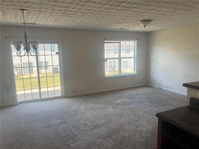 730 Georgetown Ln, Jonesboro, GA 30236 - unfurnished dining area with healthy amount of natural light, carpet flooring, and a chandelier