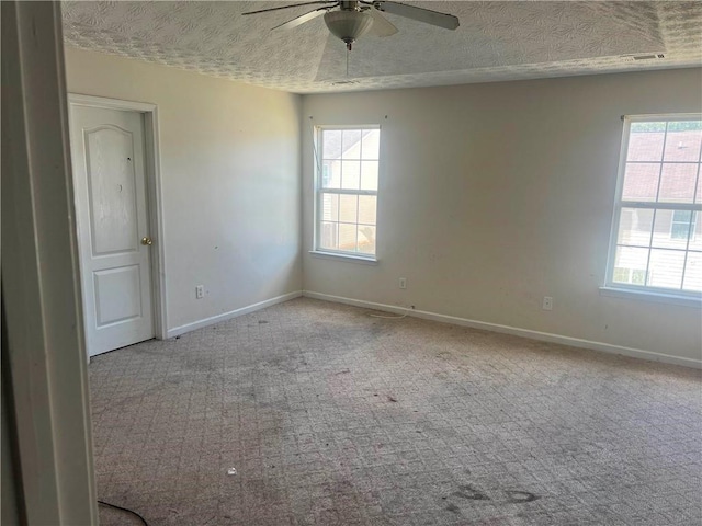 730 Georgetown Ln, Jonesboro, GA 30236 - unfurnished room with ceiling fan, plenty of natural light, carpet, and a textured ceiling