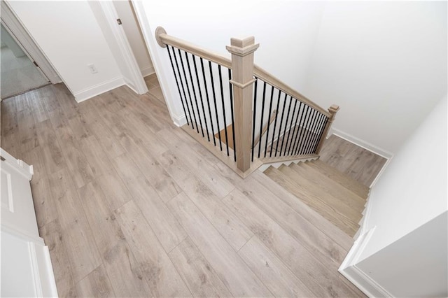 707 Dodd Ln N Unit 164, Buford, GA 30518 - stairway featuring wood finished floors and baseboards