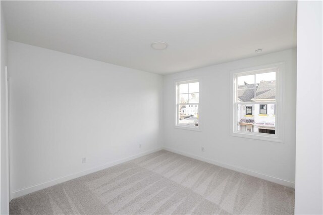 707 Dodd Ln N Unit 164, Buford, GA 30518 - unfurnished room with light carpet and baseboards